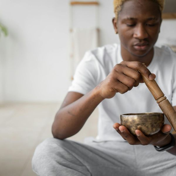 Focused man meditating after a workout session.